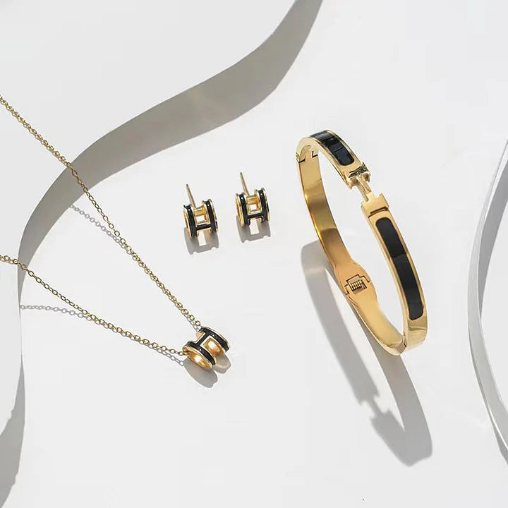 Parures trois pièces en acier titane - Bracelet, collier et boucles d'oreilles